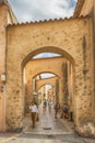 Unidentified poople walking in street, Architecture of Saint Tropez city in French Riviera, France