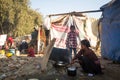 Unidentified poor people near their houses at slums in Tripureshwor district