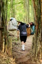 Unidentified porters carry climbers belongings