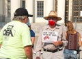 Unidentified protestor preparing for a cars and bicycle caravan promoting prop 15