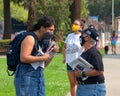 Unidentified protestor preparing for a cars and bicycle caravan promoting prop 15