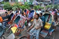 Unidentified rickshaw drivers with passengers waiting in a traffic jam in Dhaka, Bangladesh