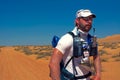 Unidentified runner resting after first stage of desert endurance running Transomania