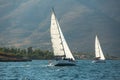 Unidentified sailboats participate in sailing regatta