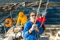 Unidentified sailors participate in sailing regatta 12th Ellada Autumn 2014 among Greek island group in the Aegean Sea,