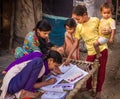 Unidentified school girls of Indian Ethnicity busy doing homework