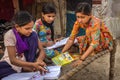 Unidentified school girls of Indian Ethnicity busy doing homework