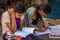 Unidentified school girls of Indian Ethnicity busy doing homework Royalty Free Stock Photo