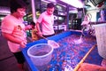 Unidentified seller in fishmarket at Chatuchak Weekend Market in Bangkok, Thailand.