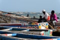 Unidentified Senegalese boys sit in the boat on the coast of th