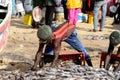 Unidentified Senegalese man collects fish on the coast of the A