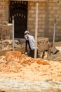 Unidentified Senegalese man works at the buildong. Royalty Free Stock Photo