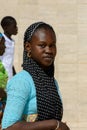 Unidentified Senegalese woman in headscarf looks ahead in the G