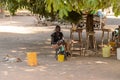 Unidentified Senegalese woman sits on the chair while her baby