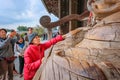 Senior woman with Binzuru at Todaiji Temple in Nara, Japan Royalty Free Stock Photo