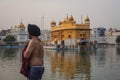 Unidentified Sikh men bath in the holy lake at Golden Temple