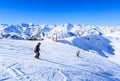 Unidentified skiers enjoy skiing at the slope in the Alps