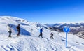 Unidentified skiers enjoy skiing at the slope in the Alps