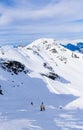 Unidentified skiers enjoy skiing at the slope in the Alps