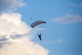 Unidentified skydiver, parachutist on blue sky Royalty Free Stock Photo