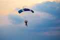 Unidentified skydiver, parachutist on blue sky Royalty Free Stock Photo