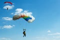 Unidentified skydivers on blue sky Royalty Free Stock Photo
