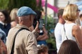 Unidentified spectator filming a concert