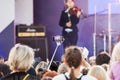 Unidentified spectator filming scene by mobile phone during a concert dedicated Moscow city day on September 9, 2019