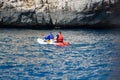Unidentified sporters in kayak is Calanque de Port-Miou near Cassis, excursion to Calanques national park in Provence, France