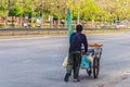 Unidentified street hawker pushing a mobile kitchen cart on a st Royalty Free Stock Photo