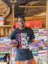 Unidentified street vendor waiting for tourists in front of his fabric stall, Sandaga Market Royalty Free Stock Photo