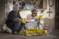 Unidentified street vendors wearing traditional clothing in the local Rodriguez market, selling flowers, in La Paz - Bolivia
