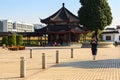 Unidentified Taoist monk uses mobile phone while walking