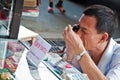 Unidentified Thai Buddhism inspects on buddha amulets