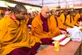 Unidentified tibetan Buddhist monks near stupa Boudhanath during festive Puja of H.H. Drubwang Padma Norbu Rinpoche's