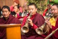 Unidentified tibetan Buddhist monks near stupa Boudhanath during festive Puja