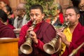 Unidentified tibetan Buddhist monks near stupa Boudhanath during festive Puja