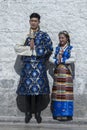 Unidentified Tibetan couple in front of Jokhang temple. The Buddhist Temple in Barkhor Square , Lhasa Tibet