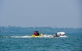 Unidentified tourist enjoying a Banana ride at Tarkarli beach. The beach is famous for various water sports activities Royalty Free Stock Photo