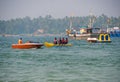 Unidentified tourist enjoying a Banana ride at Tarkarli beach. The beach is famous for various water sports activities Royalty Free Stock Photo