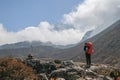 Unidentified tourist trekking in nepal walking from dingboche to chukung within sagarmatha national park on everest base camp