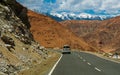 Unidentified tourist vehicles on Mountain road of Ladakh, Northern India. Beautiful landscape of Ladakh, highest plateau in India