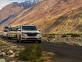 Unidentified tourist vehicles on Mountain road of Ladakh, Northern India. Beautiful landscape of Ladakh, highest plateau in India