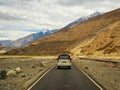 Unidentified tourist vehicles on Mountain road of Ladakh, Northern India. Beautiful landscape of Ladakh, highest plateau in India