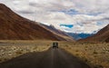 Unidentified tourist vehicles on Mountain road of Ladakh, Northern India. Beautiful landscape of Ladakh, highest plateau in India