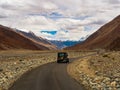 Unidentified tourist vehicles on Mountain road of Ladakh, Northern India. Beautiful landscape of Ladakh, highest plateau in India