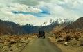 Unidentified tourist vehicles on Mountain road of Ladakh, Northern India. Beautiful landscape of Ladakh, highest plateau in India