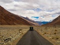 Unidentified tourist vehicles on Mountain road of Ladakh, Northern India. Beautiful landscape of Ladakh, highest plateau in India