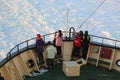 Unidentified tourists aboard the arctic Icebreaker Sampo during unique cruise in frozen Baltic Sea. Royalty Free Stock Photo