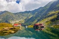 Unidentified tourists enjoy the sights of Balea Lake at 2,034 m altitude in Fagaras Mountains Royalty Free Stock Photo